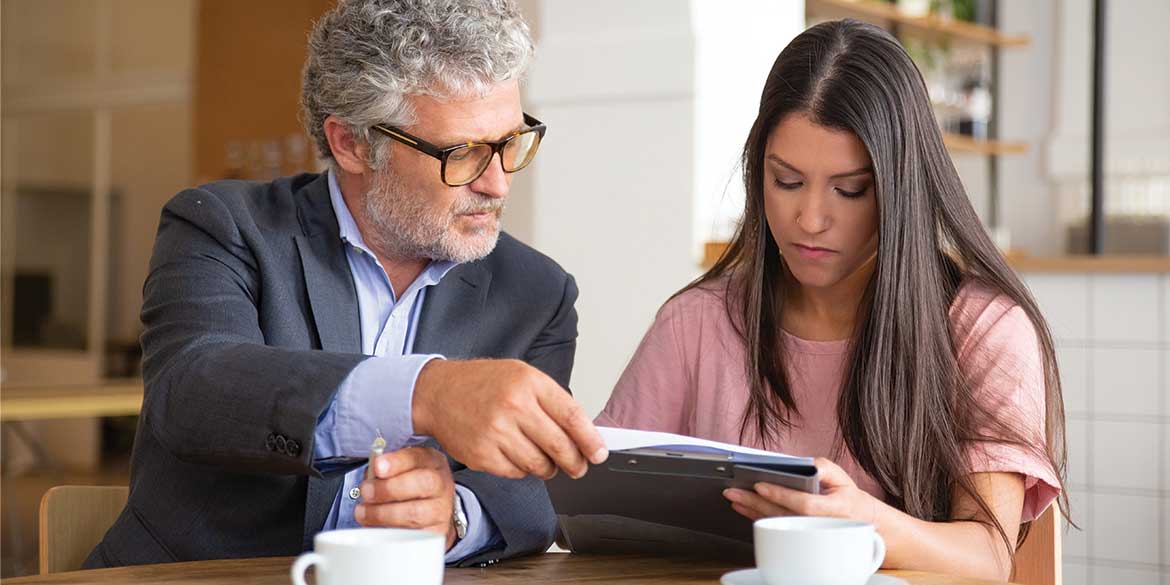Financial advisor assisting a women.