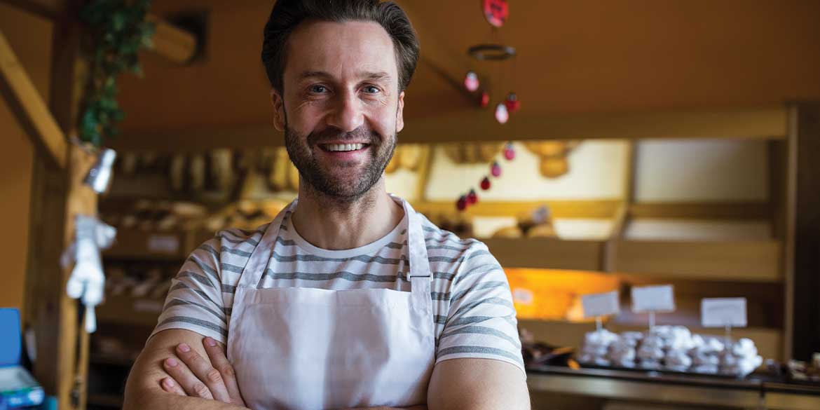 Business owner in apron.