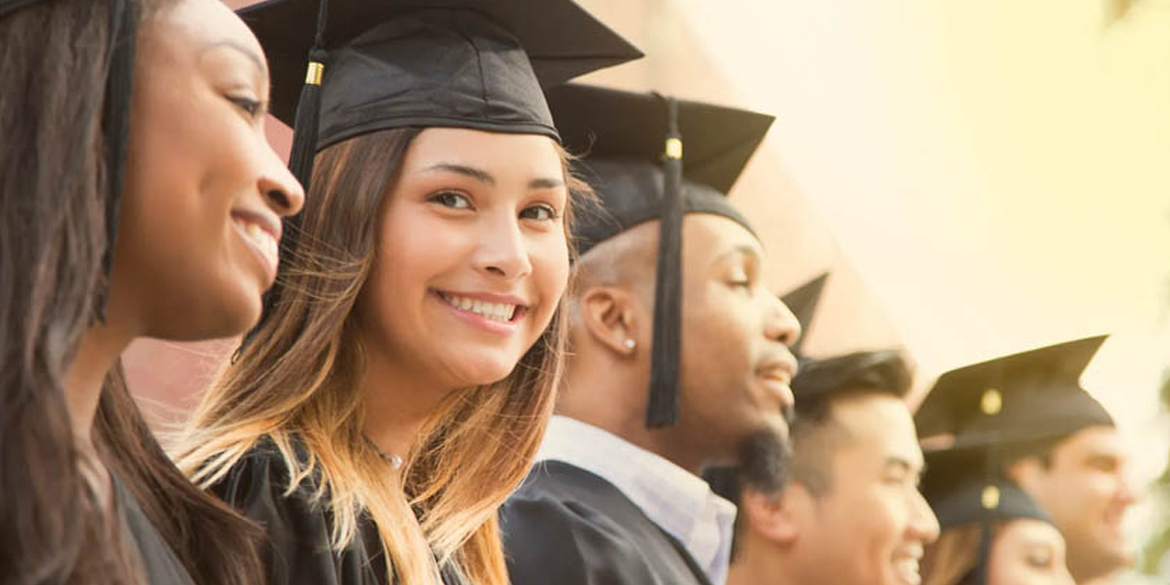 Smiling-Woman-in-Black-Graduating-Cap-and-Gown-in-Crowd-Small-Card.jpg