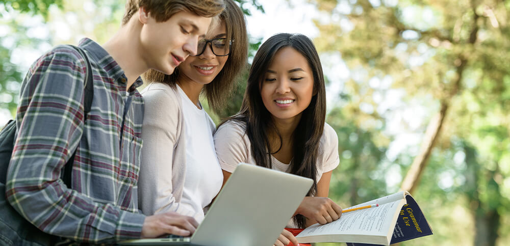 students looking at laptop