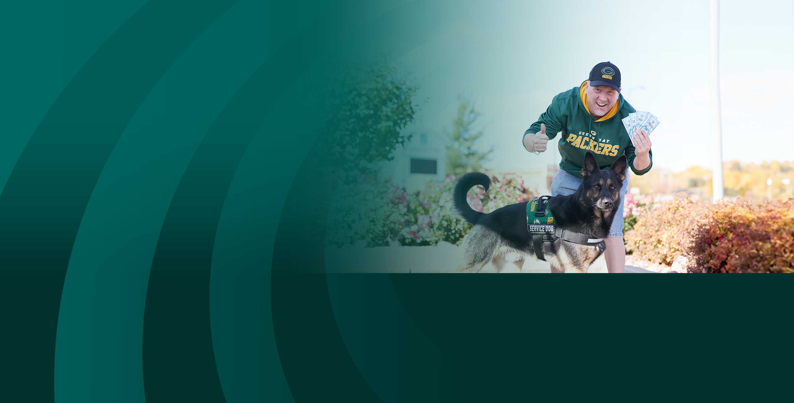 Man in Packer Shirt with money and a dog in Packer gear for Everyday Banking
