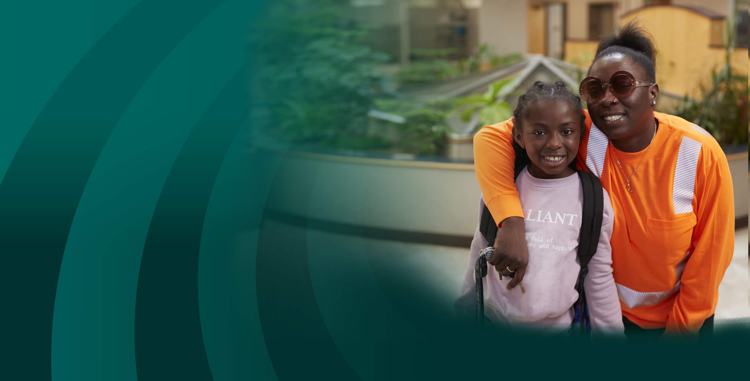Member-Owner Regineisha R. with her daughter visiting the Oneida St. branch.