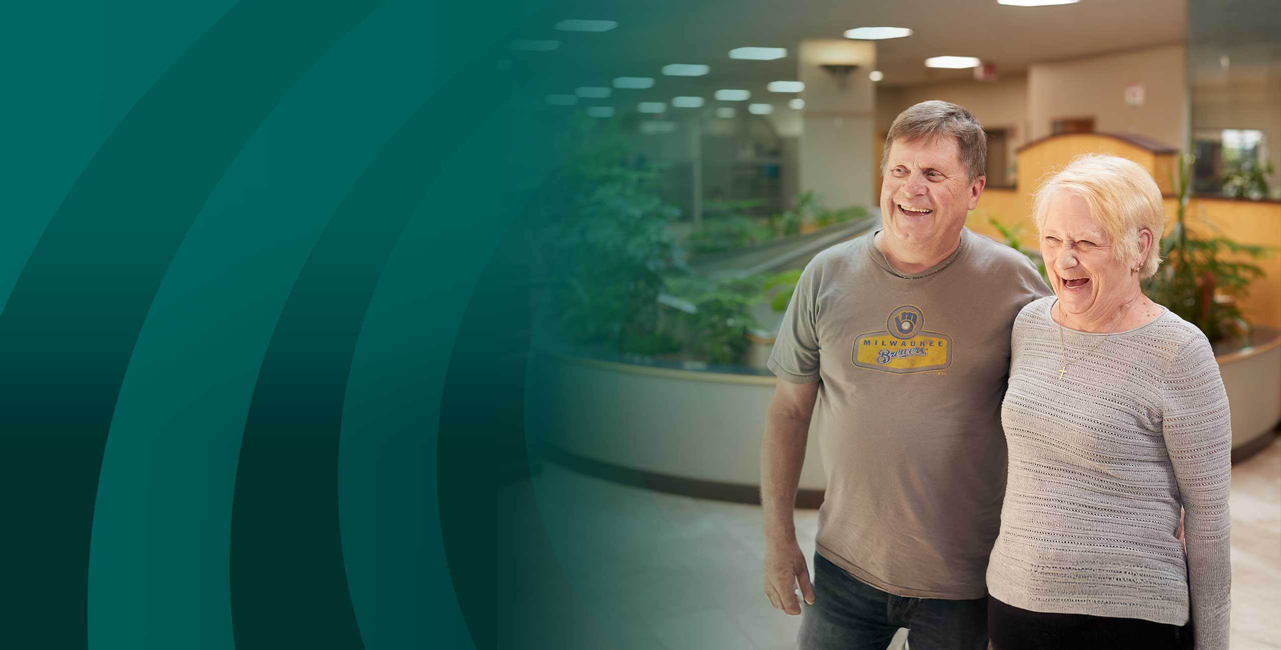 Grandparents reviewing CDs and IRA options in one of our Community First Credit Union branches