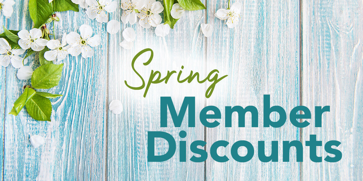 White and Blue Wood Panel Background with White Flowers Text Spring in green script, Member Discounts in blue block text.
