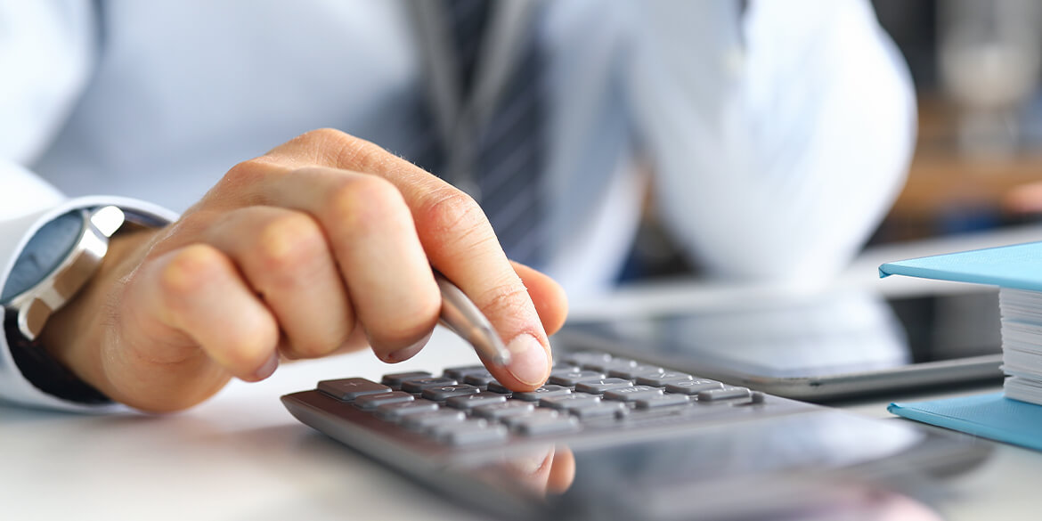 man using a calculator.