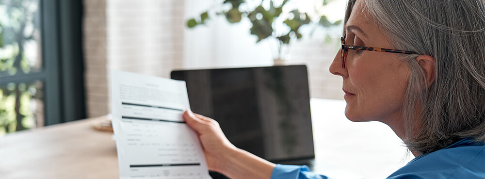 lady looking at paperwork.