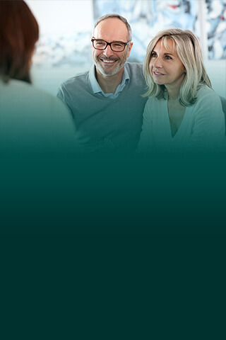 Couple talking with consultant.