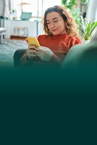 Woman relaxing using phone.