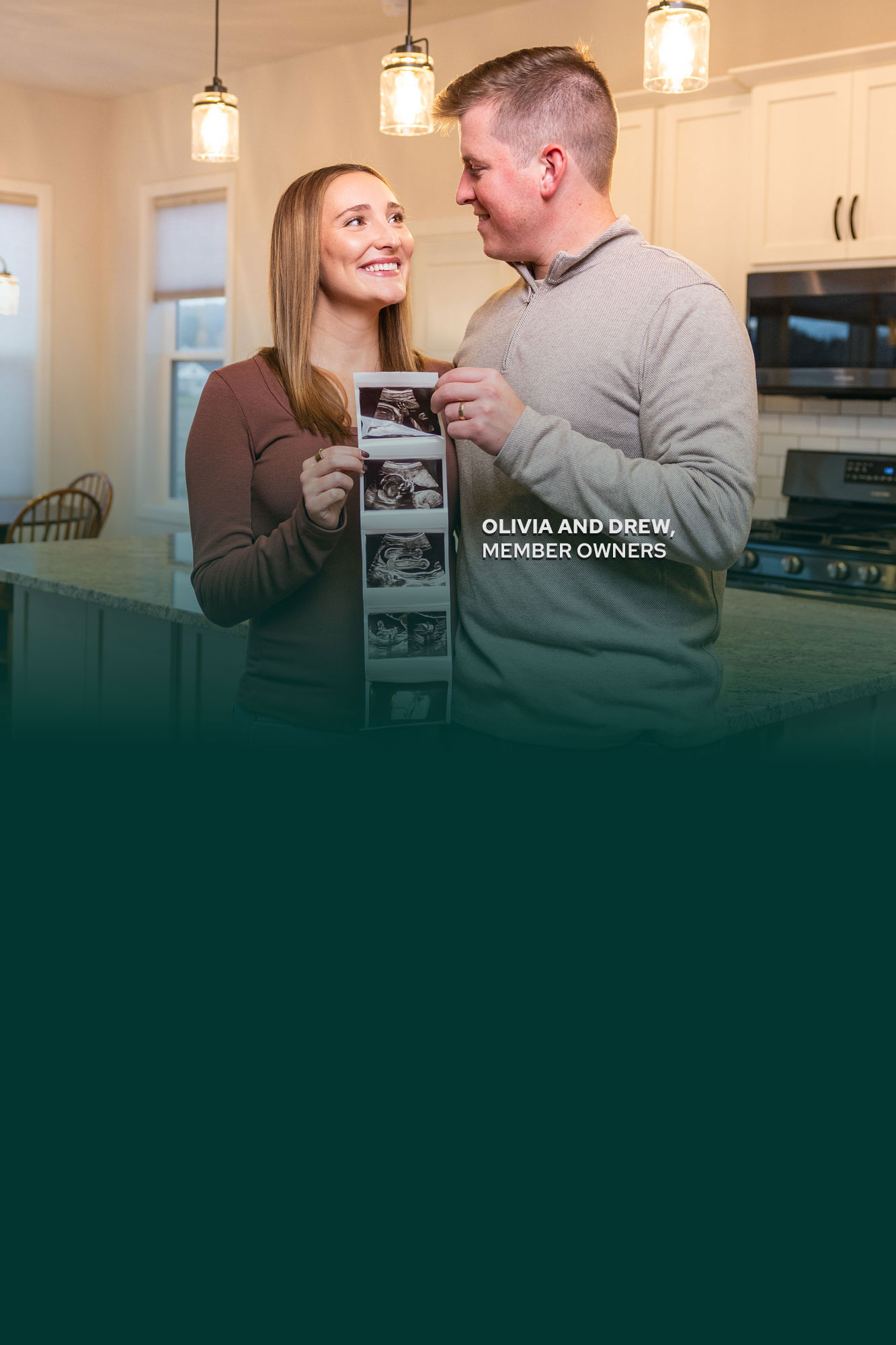 Couple holding baby photos