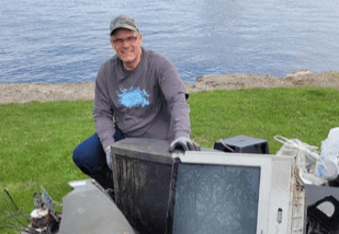 CFCU Volunteer Cleaning Up Fox Wolf Watershed Alliance.