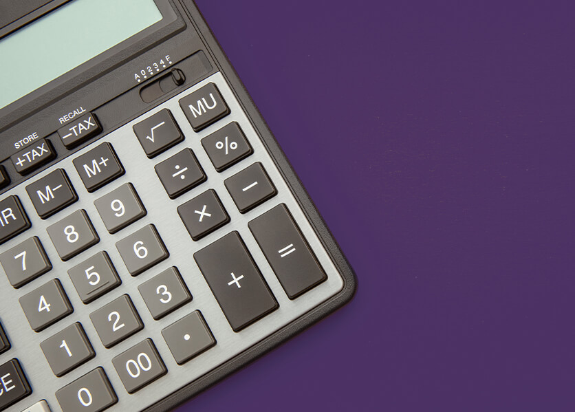calculator on yellow desk.