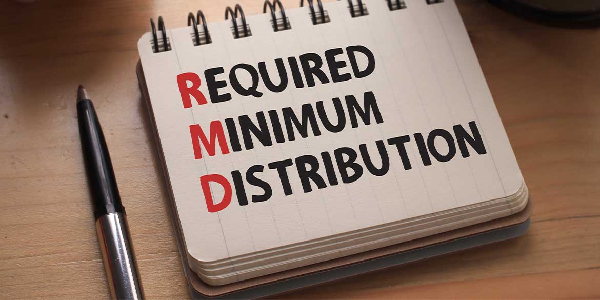 Notepad with pen that displays Required Minimum Distribution