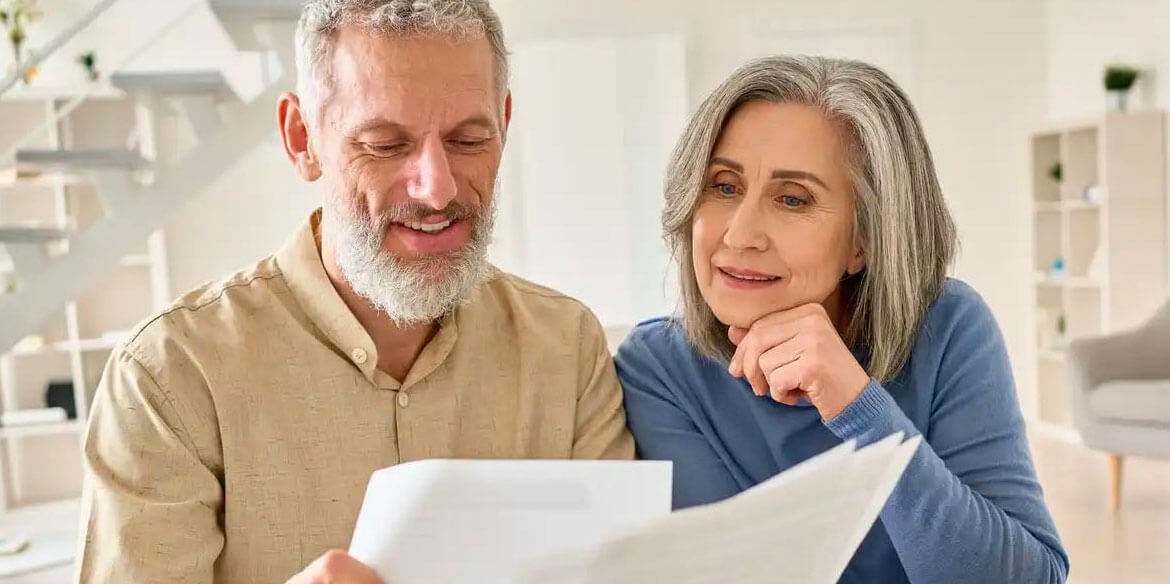 Man and woman looking at their estate planning documents.