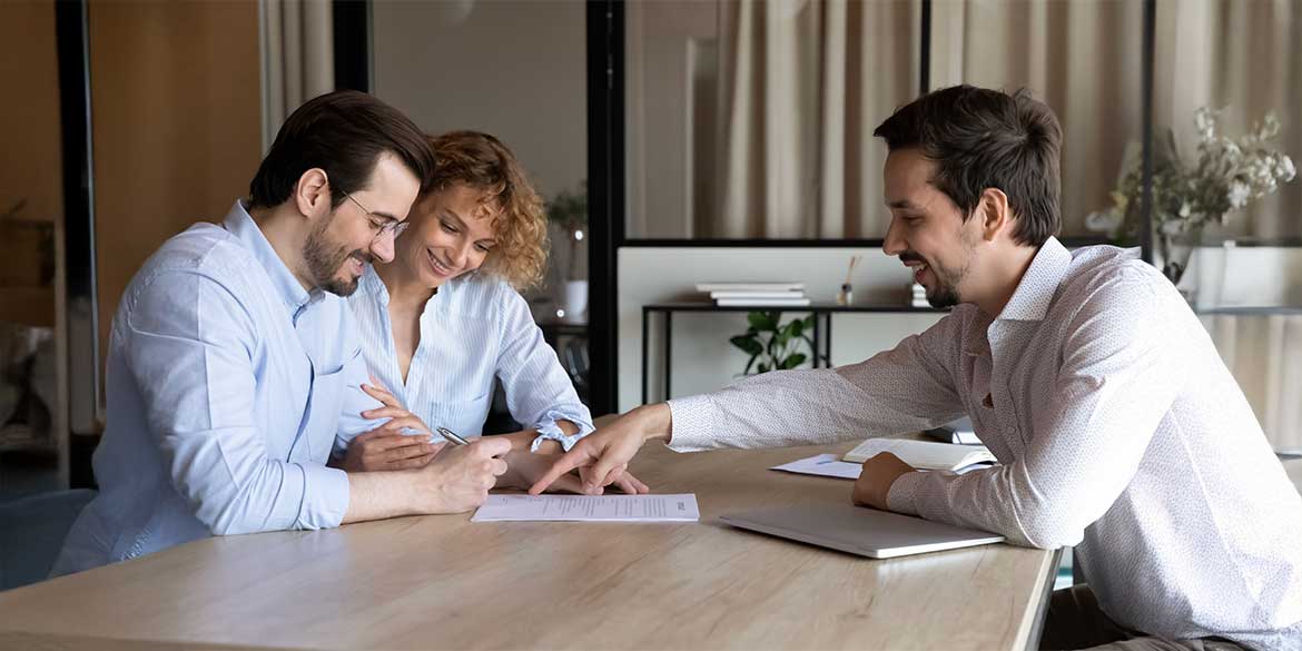 Couple meeting with financial advisor to preserve inheritance.