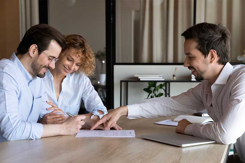 Couple meeting with financial advisor to preserve inheritance.