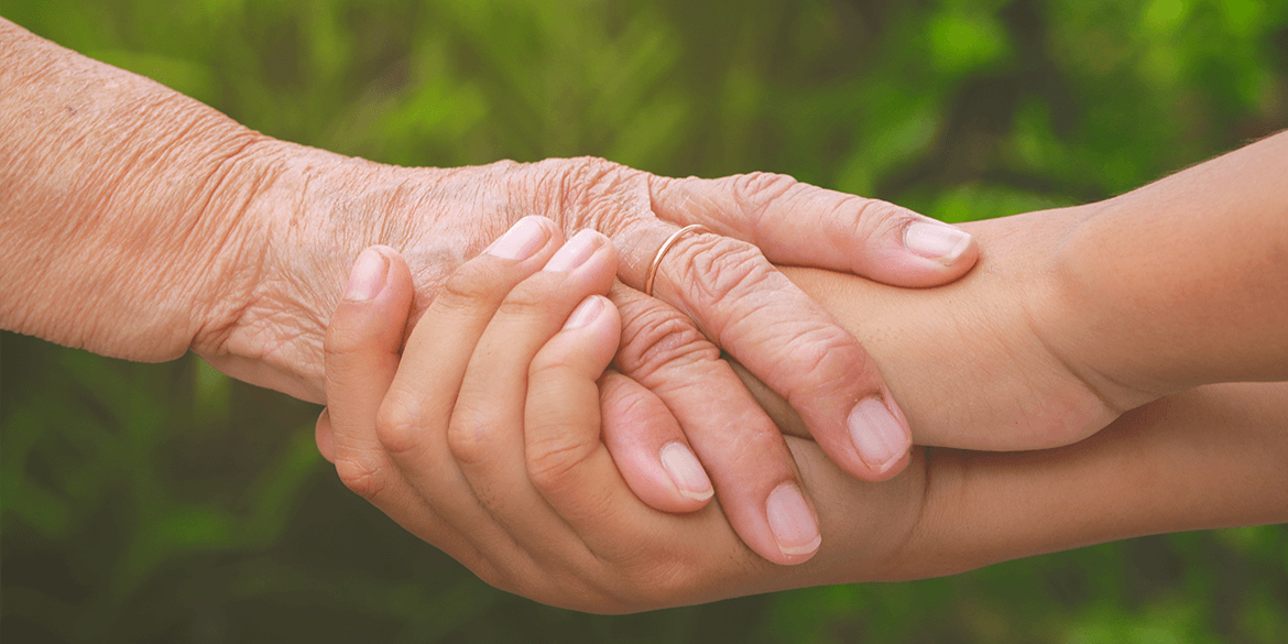 Young and old holding hands.