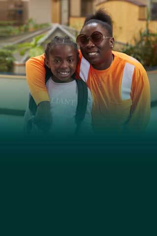 Member-Owner Regineisha R. with her daughter visiting the Oneida St. branch.