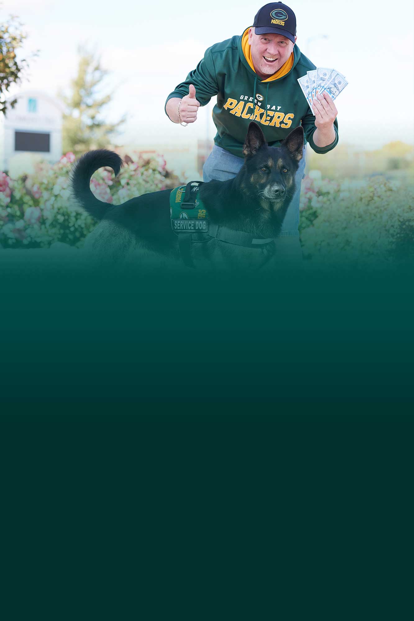 Man in Packer Shirt with money and a dog in Packer gear for Everyday Banking
