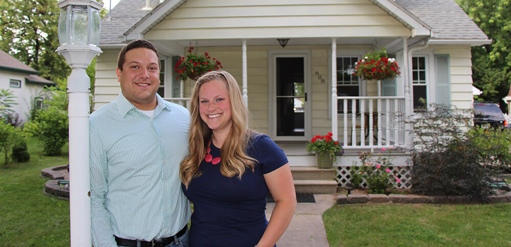 happy couple outside of home