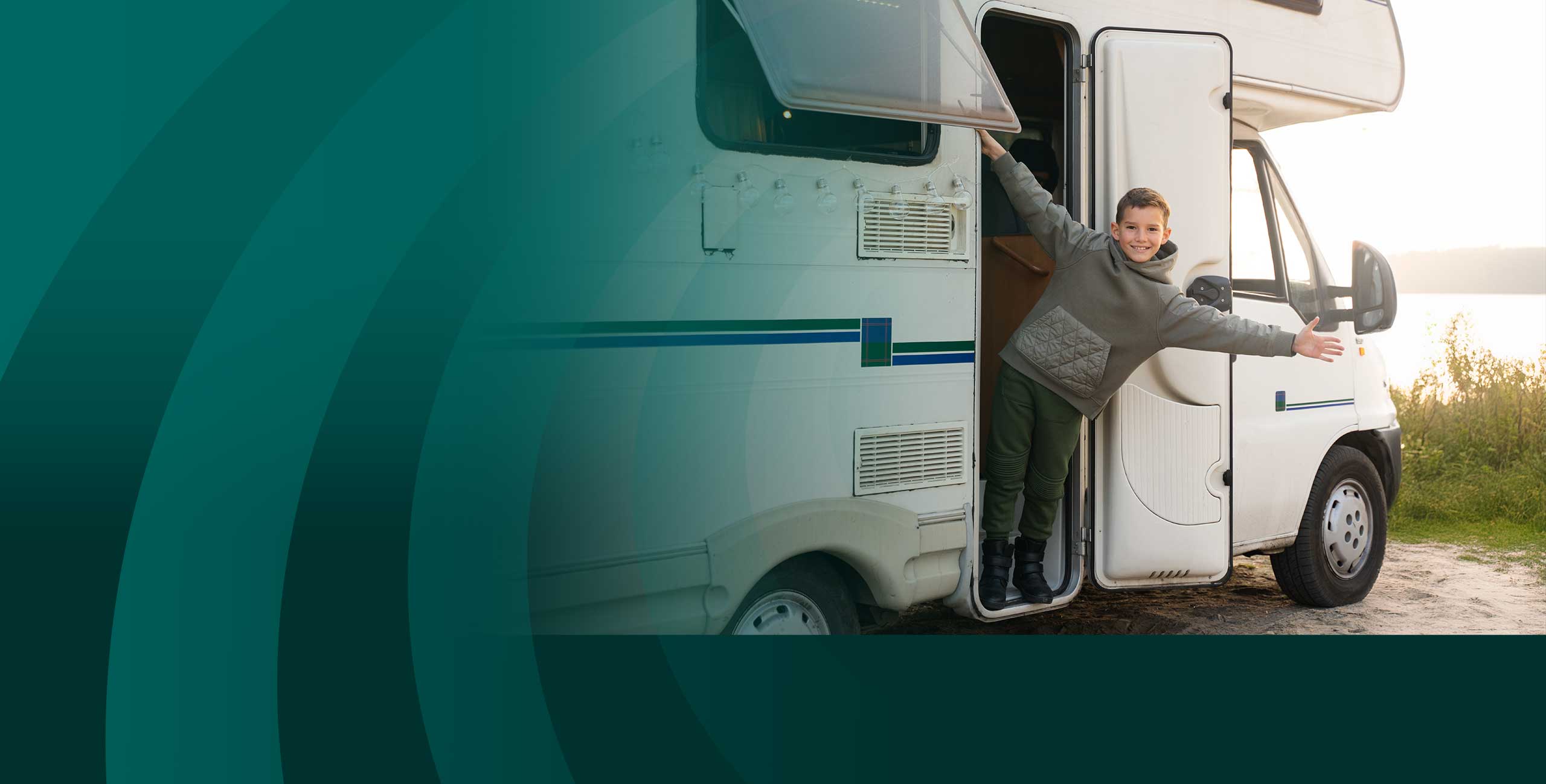 Kid standing on the steps of a camper smiling with an anytime loan from Community First Credit Union