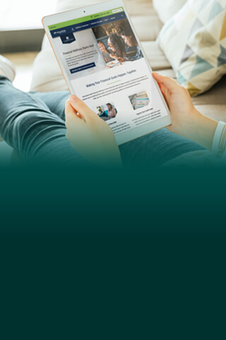 person on couch with tablet.