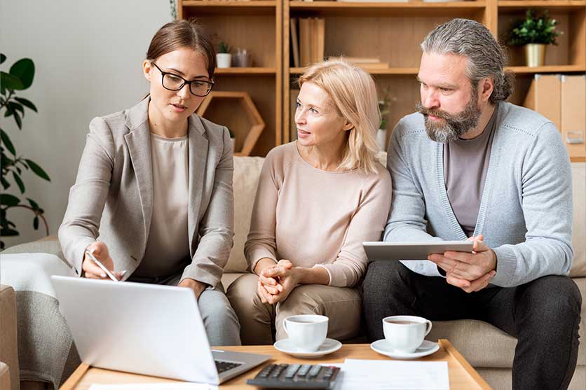 Couple meeting with financial advisor.
