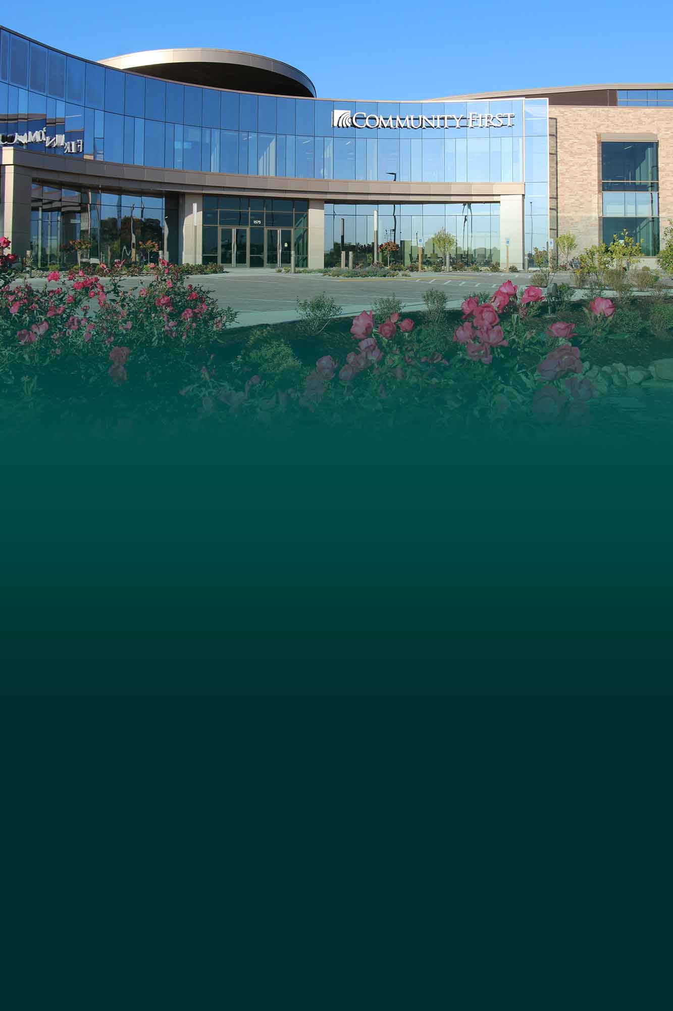 Home office two story building in the spring with teal fade.