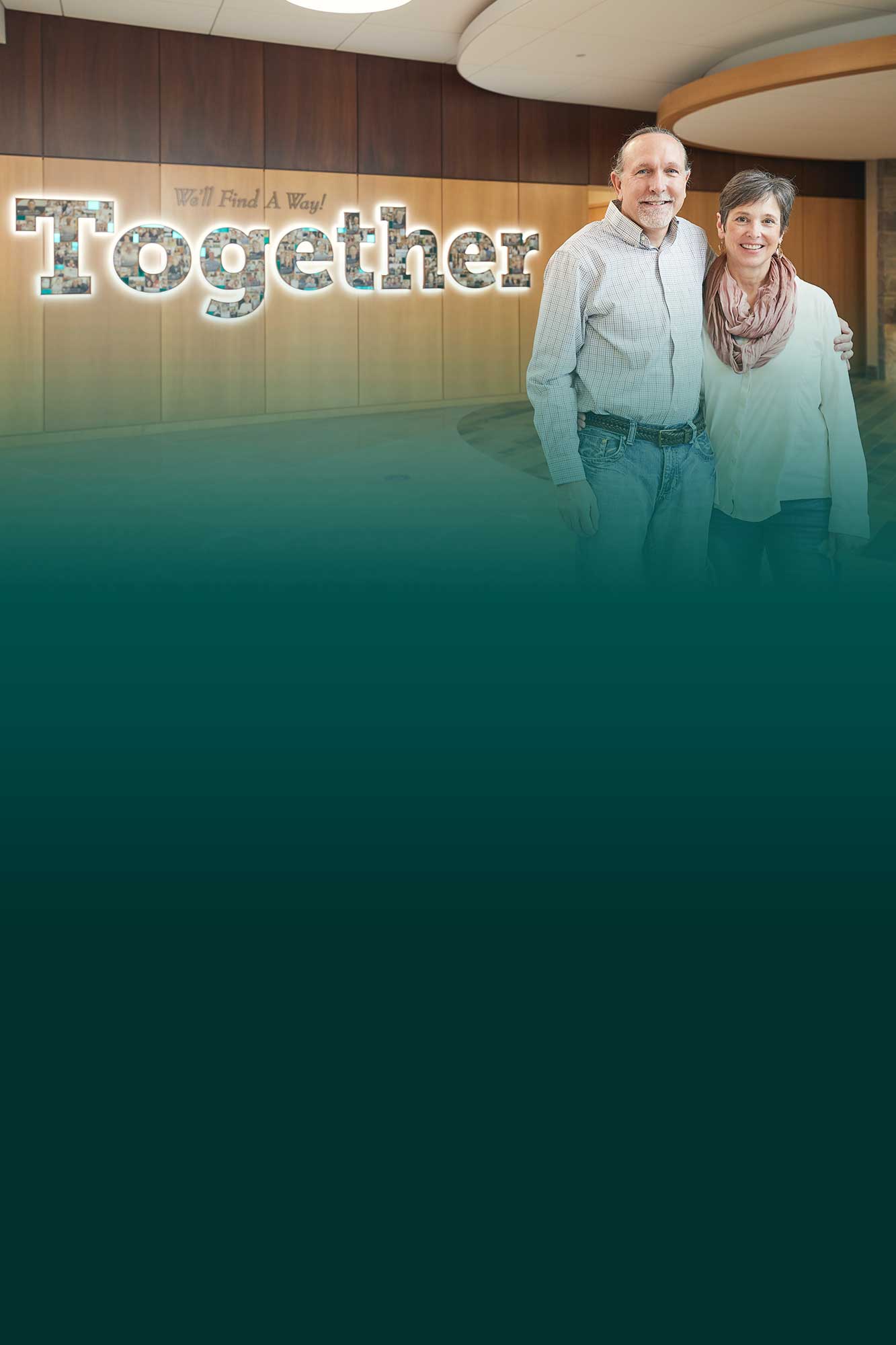 Together we can make a difference with a couple standing near our sign